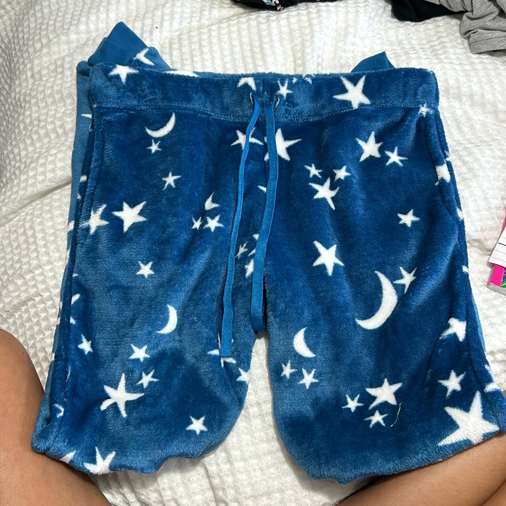 Blue pagans pants with white starts all over them